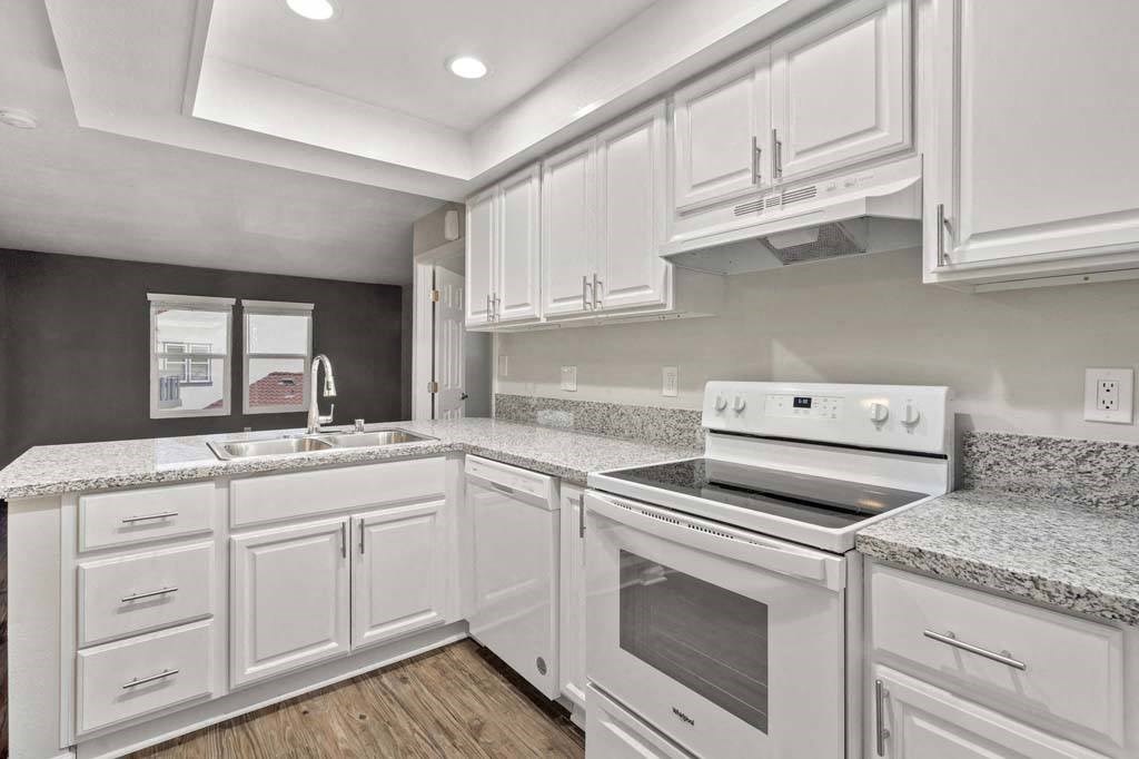 a kitchen with a stove top oven next to a sink at Aspire Corona, Corona, 92882