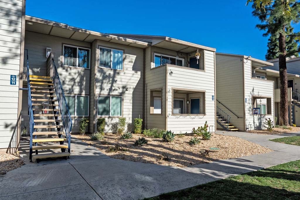 a building with a staircase in front of it at Aspire Rialto, Rialto, CA
