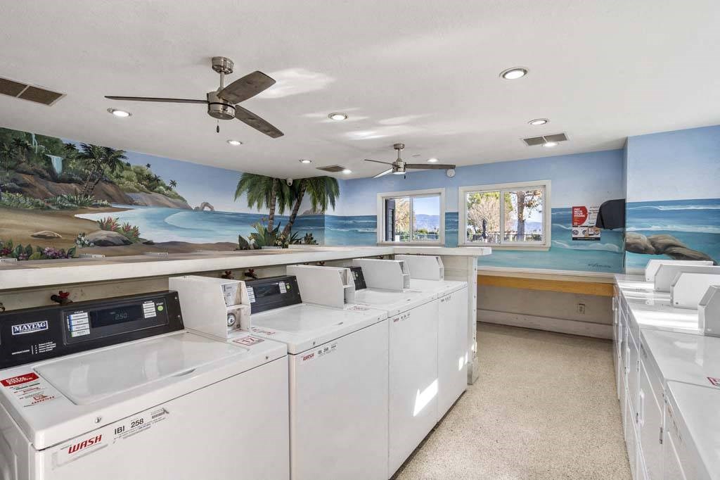 a washer and dryer room with a mural on the wall at Aspire Rialto, Rialto, 92376