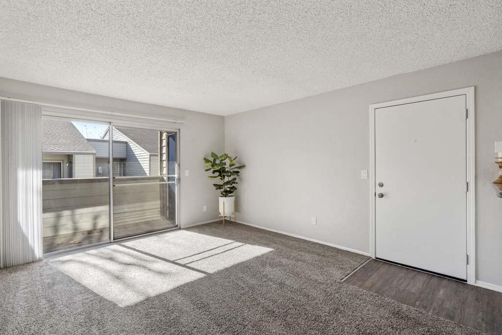 a bedroom with a sliding glass door and a patio at Aspire Rialto, Rialto, CA 92376