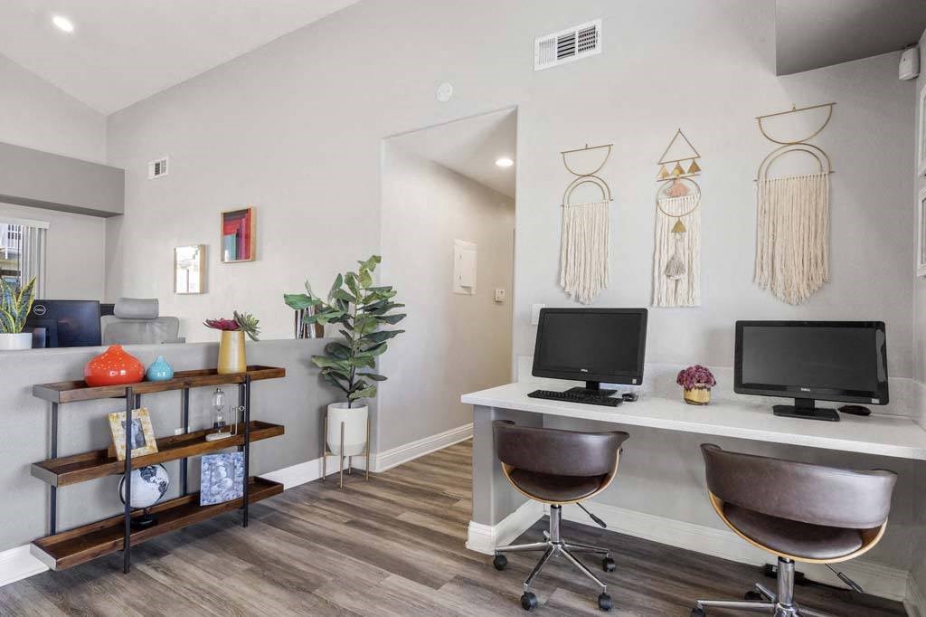 a room with a desk and two computer monitors at Aspire Redlands, California