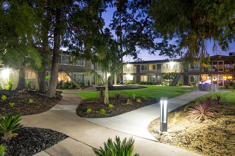 Lit sidewalks to building at Aspire Sacramento Apartments, Sacramento, 95825