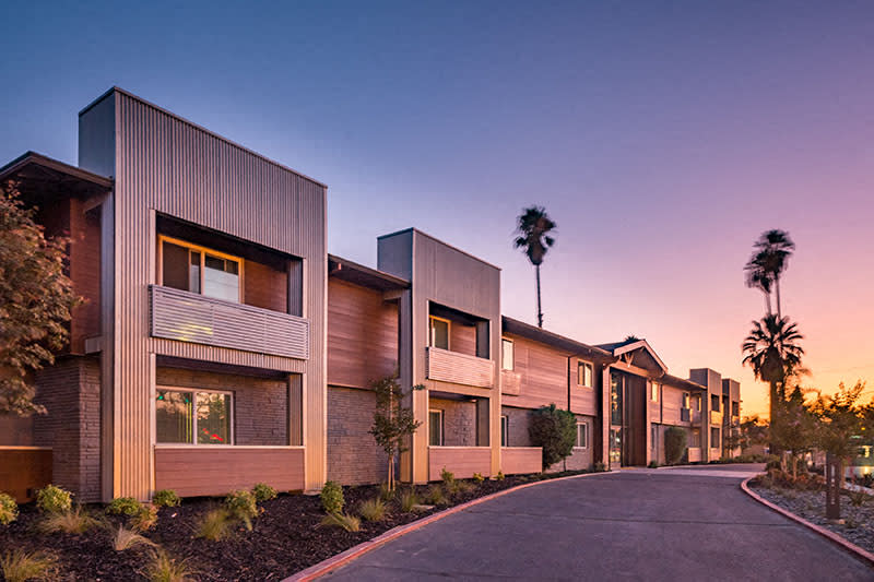 Pet-Friendly Apartments in East Sacramento, CA- Aspire Sacramento- Building Exterior with Patios and Landscaping
