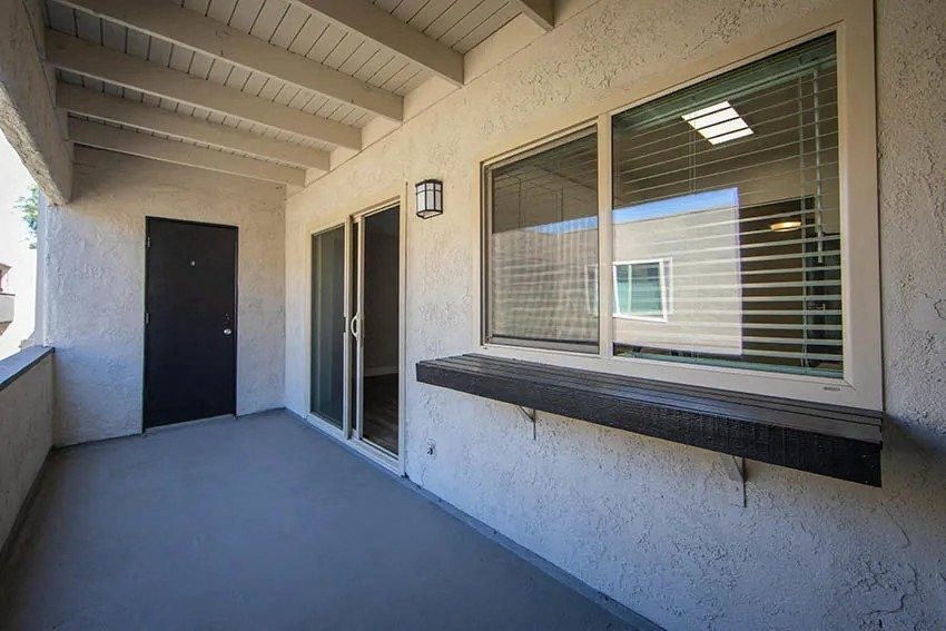 a large window on the side of a building with a door at Aspire Upland Apartments, Upland