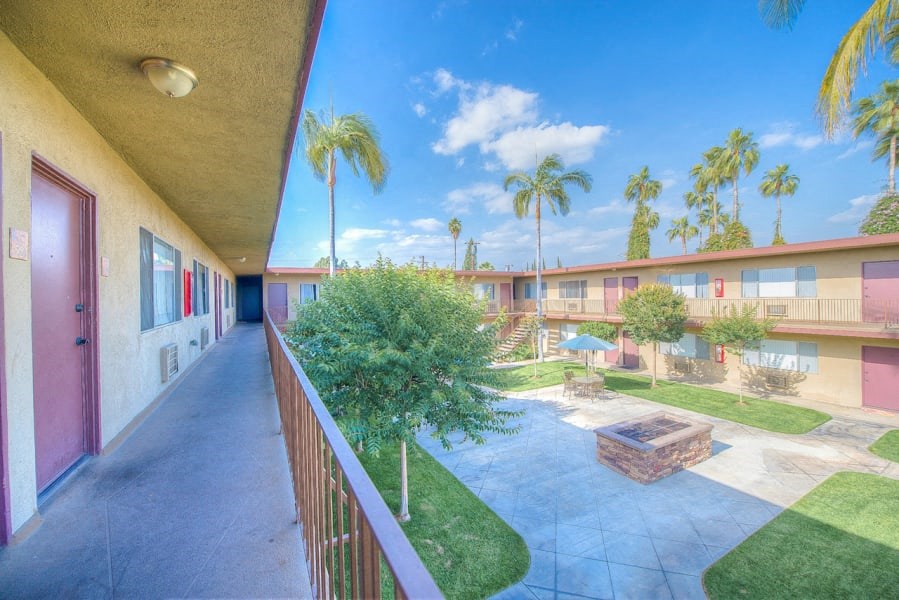 West Covina Apartments for Rent - Courtyard with Lush Landscaping and Walkways Surrounded by Tuscany Villas Apartment Buildings at Tuscany Villas Apartments, California