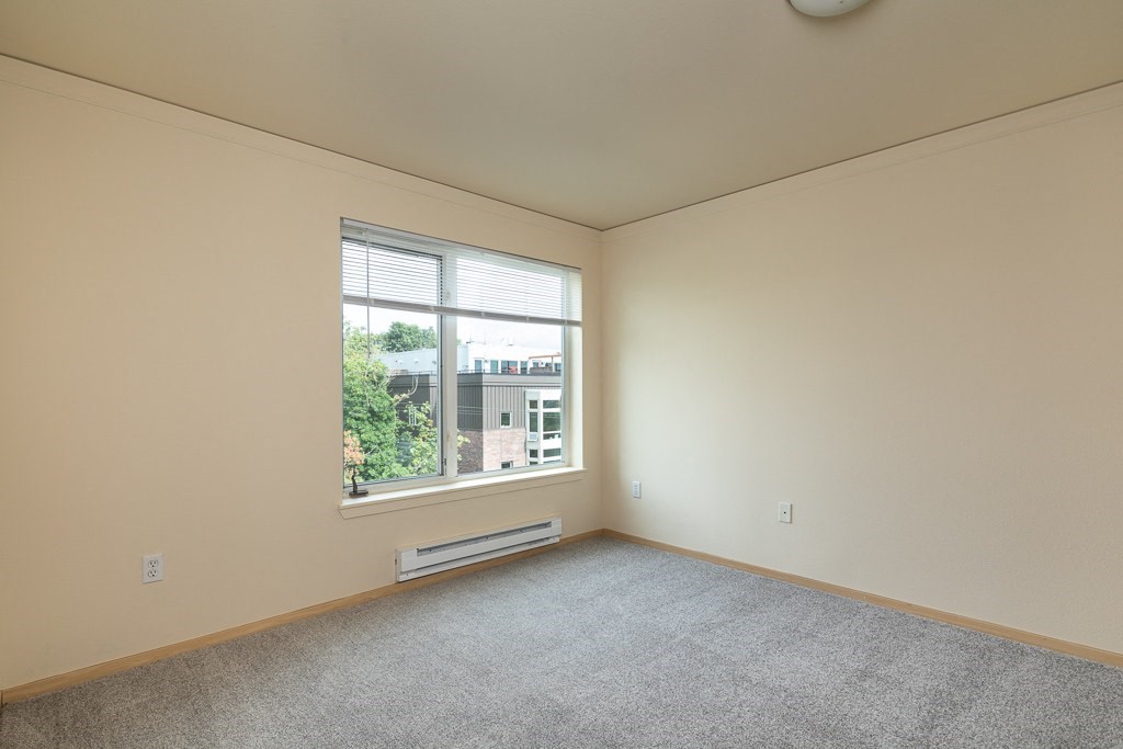an empty living room with a large window