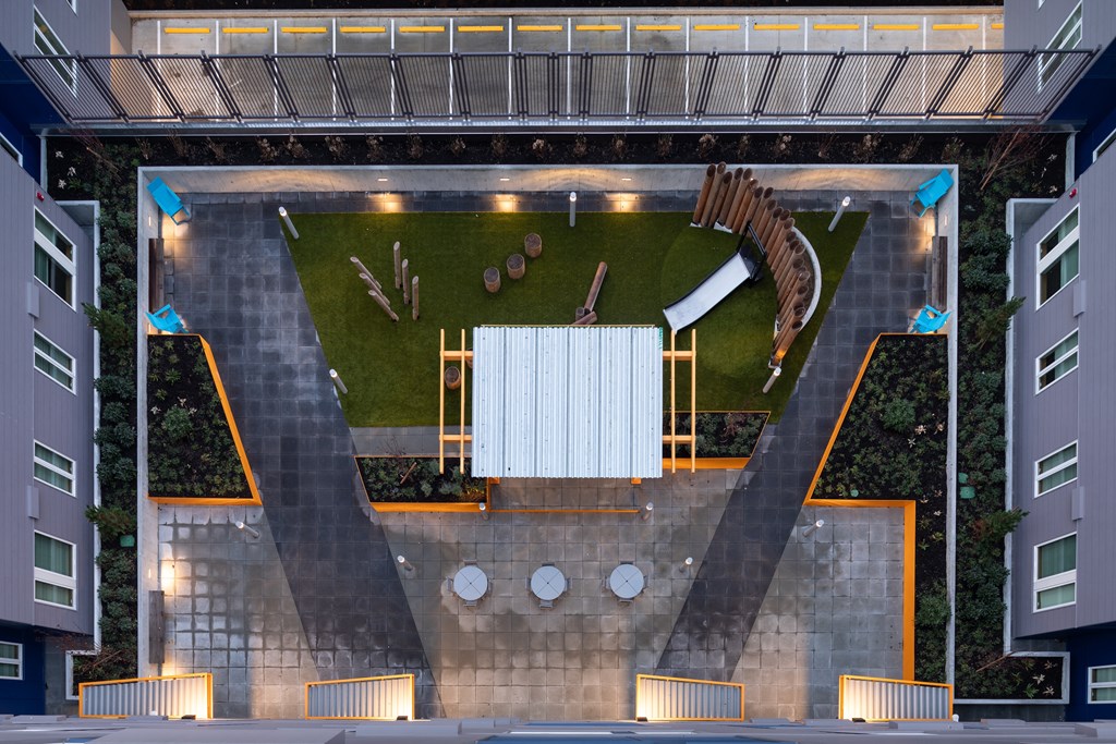 a rendering of an aerial view of a courtyard with a sculpture of a horse and