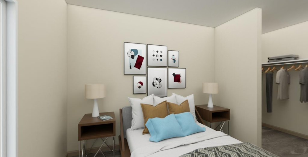 a bedroom with a bed and a wardrobe in a 555 waverly unit
