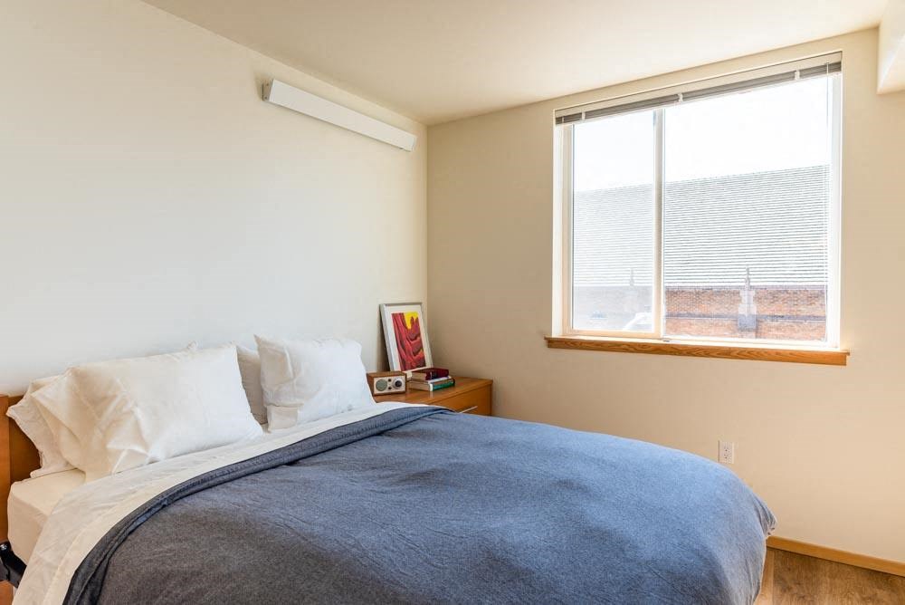 Bedroom with window at Arbora Court, Washington