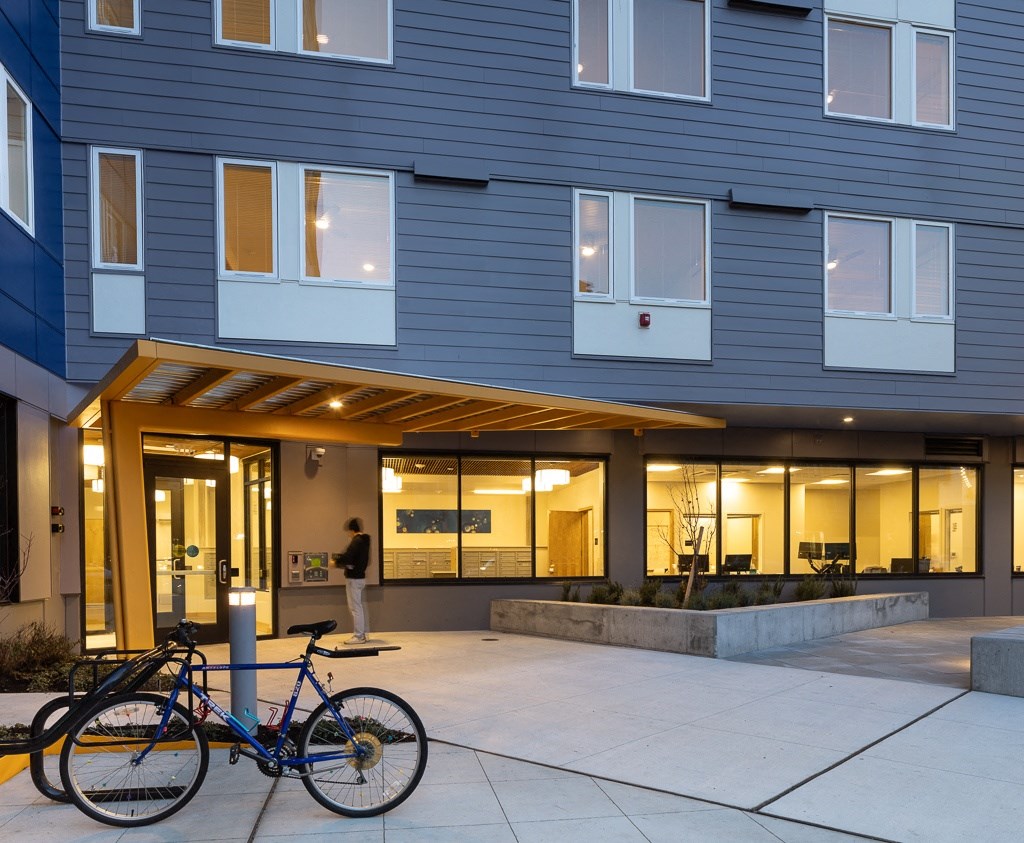 two bikes parked in front of a building