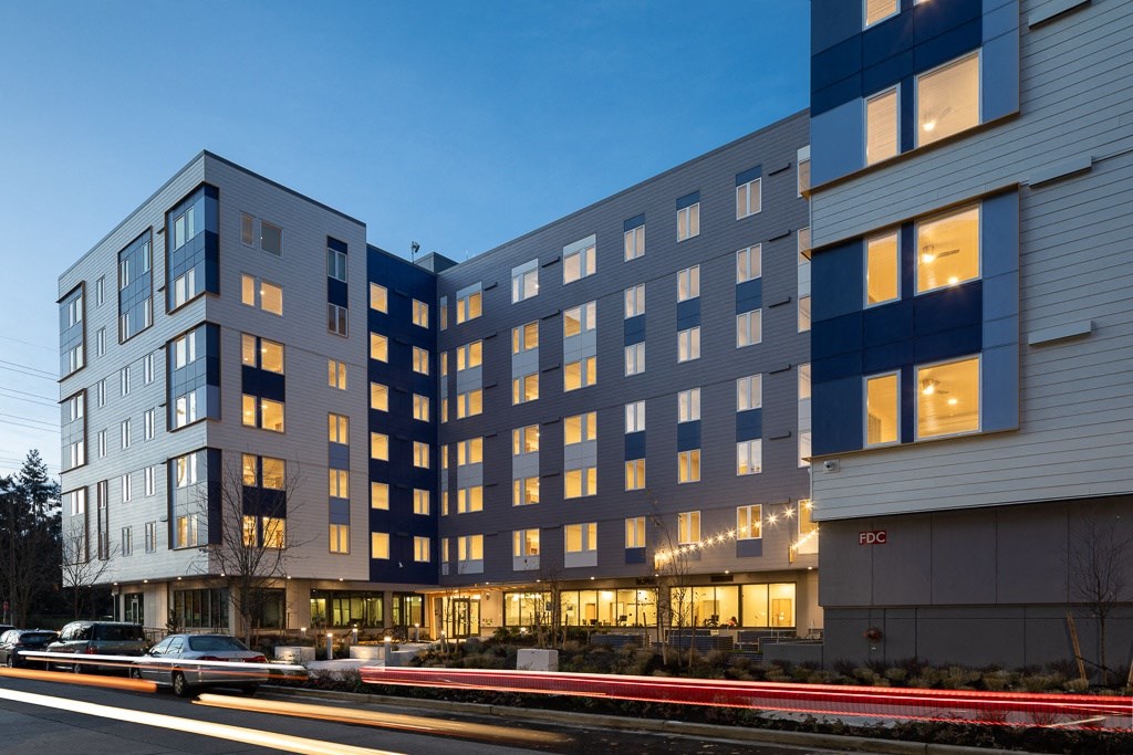 a large building with a street in front of it