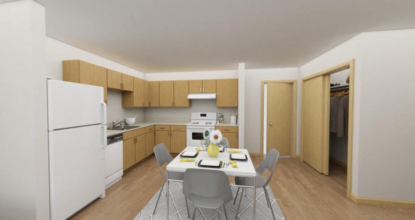 a kitchen and dining room with a table and chairs