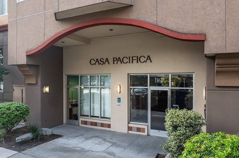 The front of a building with the name CASA PACIFICA on it.