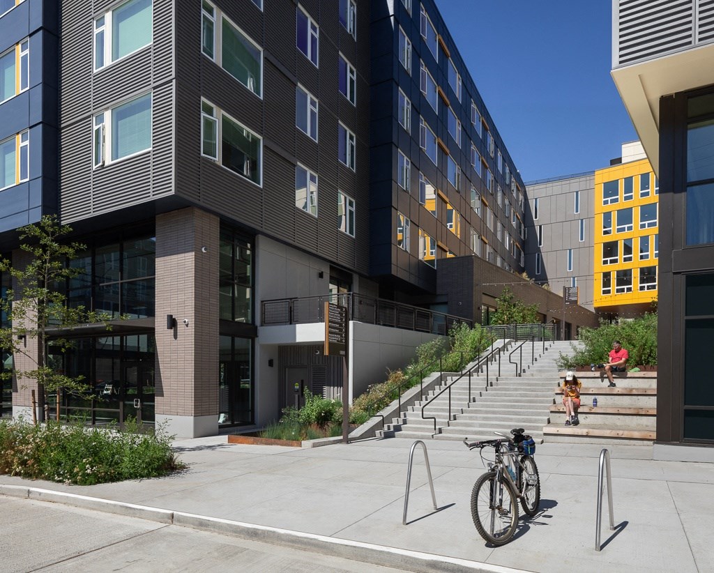 a bike parked in front of a building with stairs