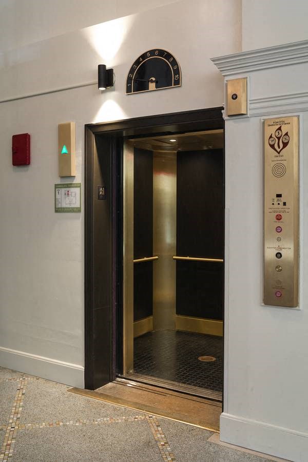 elevator in a building with a door open at Cambridge Apartments, Seattle, Washington