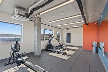 A gym with a view of the city.