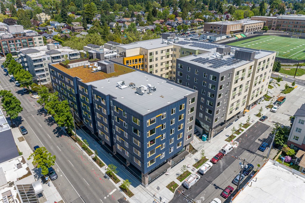 an aerial view of a group of buildings and a football field
