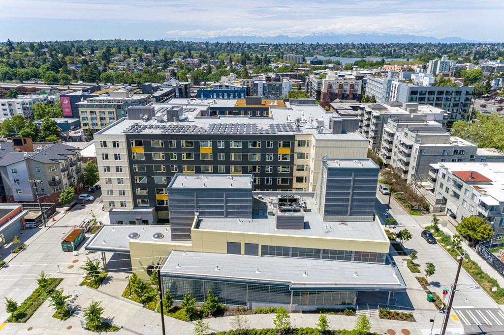 an aerial view of a city with buildings and trees