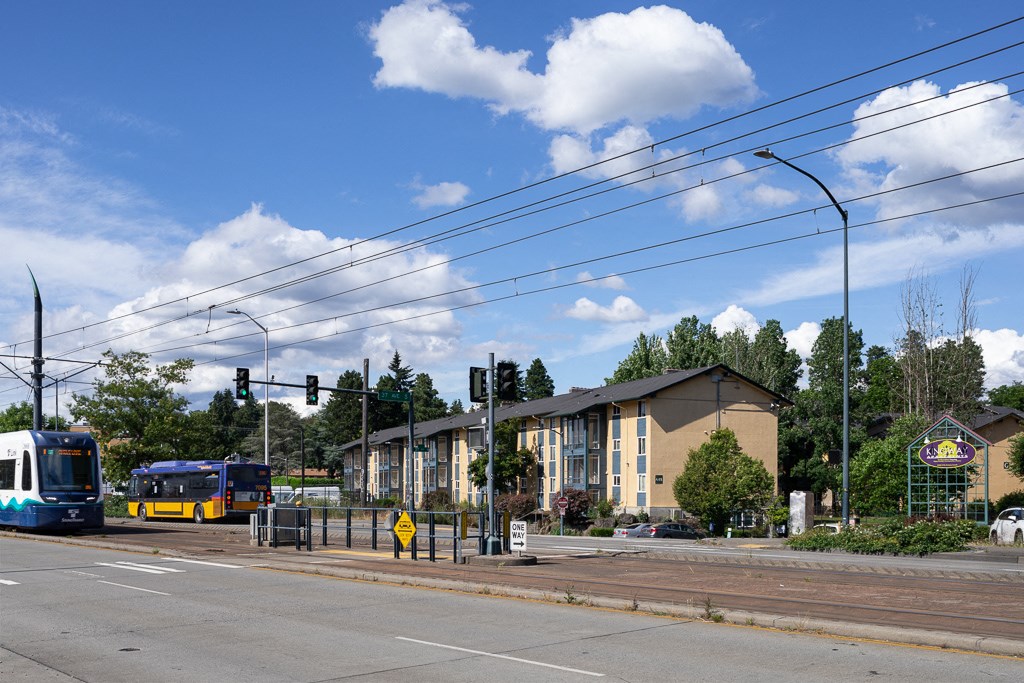 a city street with a bus and a building