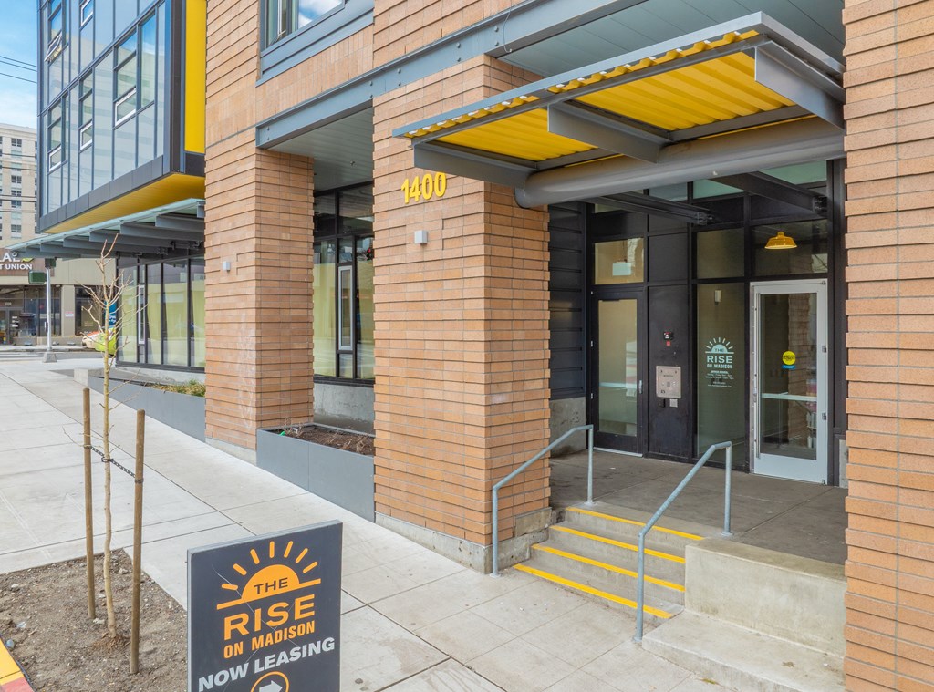 The front of a building with a sign that says