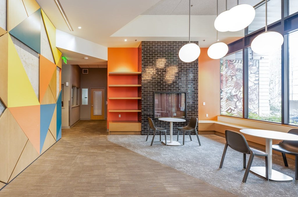 A modern office space with a colorful geometric design on the wall.