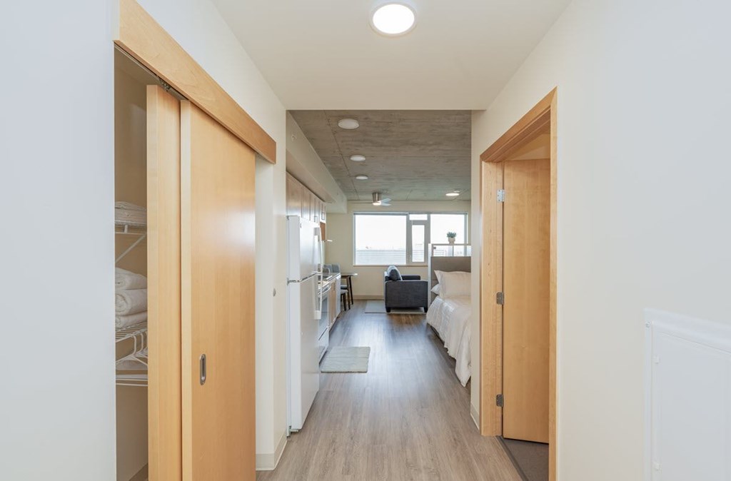 A long hallway with beds on either side.