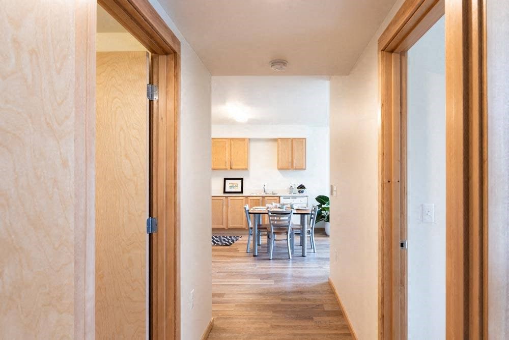 a view of a kitchen and dining room from a doorway at Arbora Court, Seattle, 98105