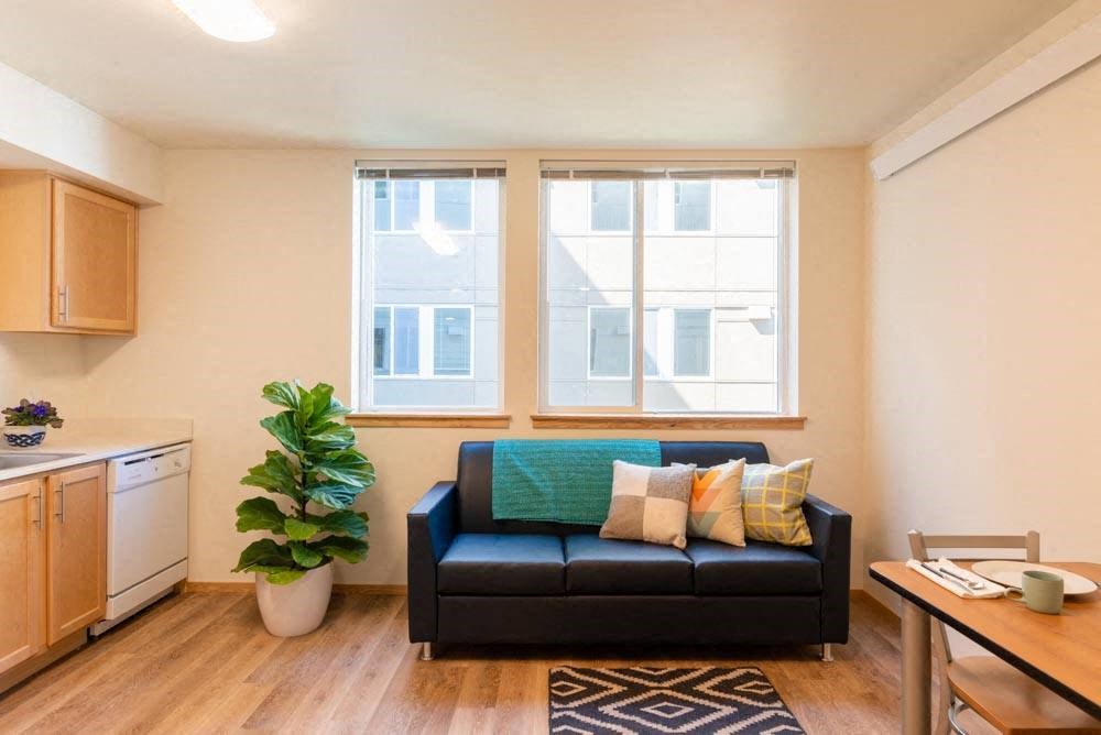 a living room with a couch and a window at Arbora Court, Washington