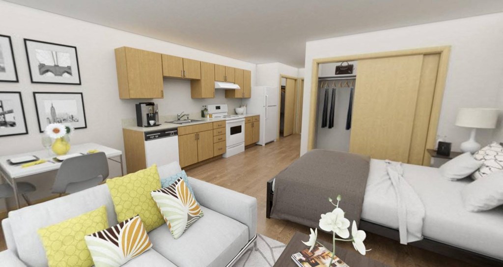 A modern living room with a grey couch and a coffee table.