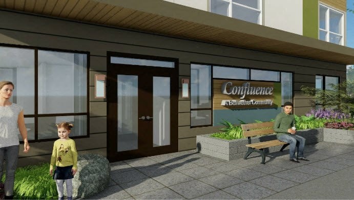 A woman and a child are walking towards a building with a sign that reads "Confluence.".