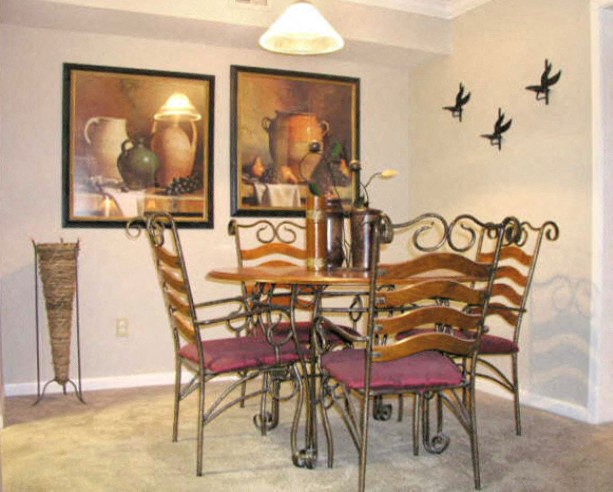 a dining room with a table and chairs