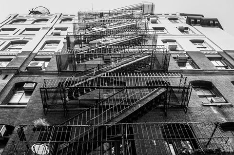 fire escapes on the side of an apartment building