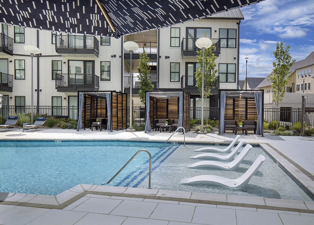 Upton Oxmoor Apartments Louisville resort-style pool with tanning ledge and cabanas