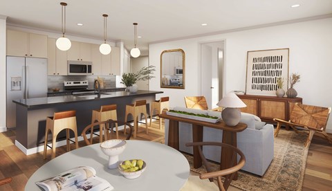 A modern kitchen with a dining table and chairs.