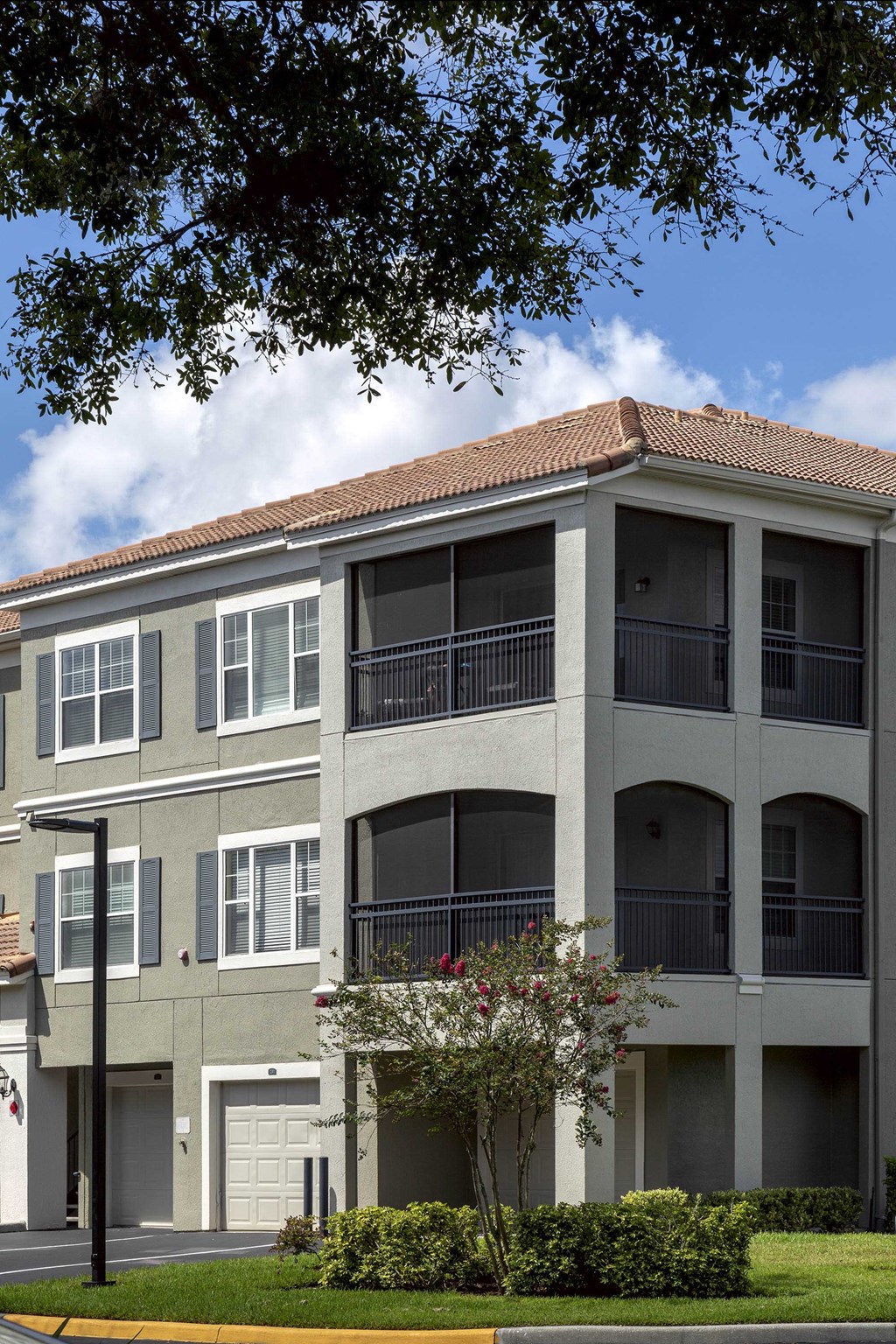 Sanford Lake's Edge Apartments  building exterior with screened balconies