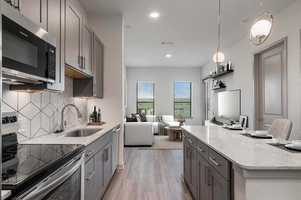 Sagemont Apartments Irving Texas modern kitchen with quartz countertops