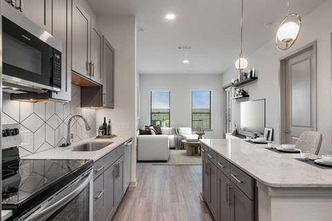 Sagemont Apartments Irving Texas modern kitchen with quartz countertops