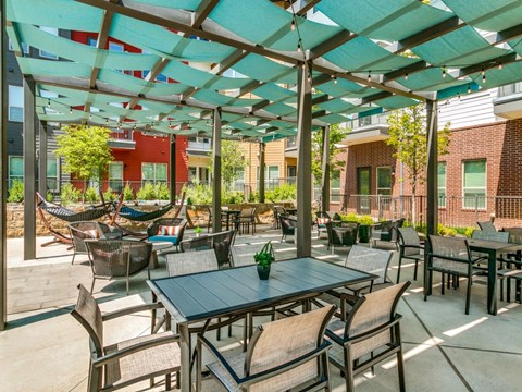 Sagemont Apartments Irving Texas shaded patio with lounge seating
