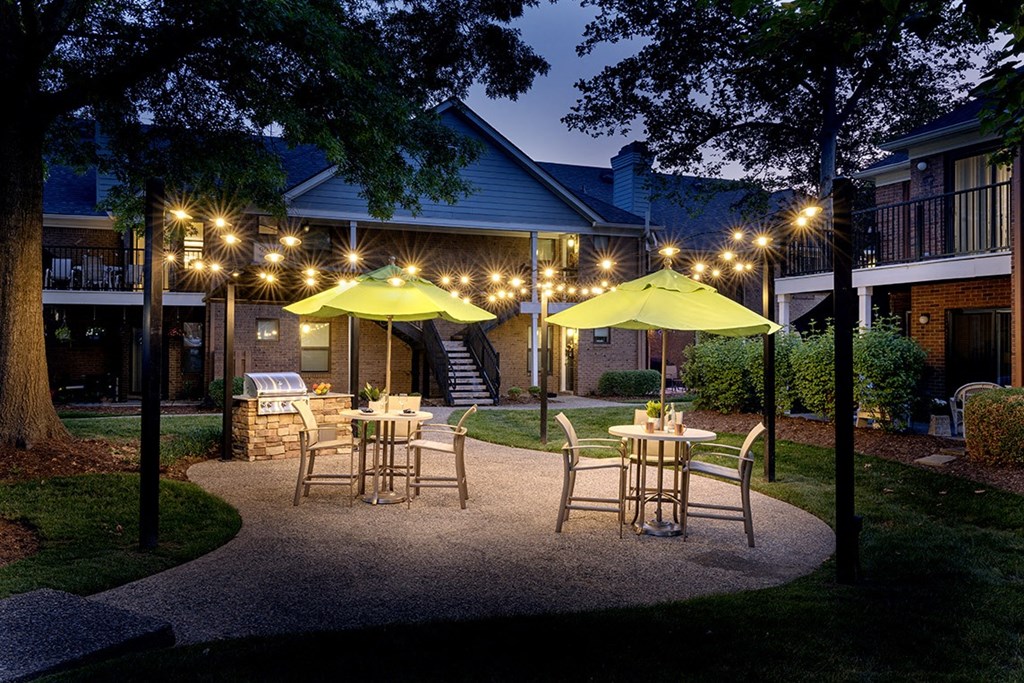 The Willows Apartments Louisville outdoor dining area at dusk