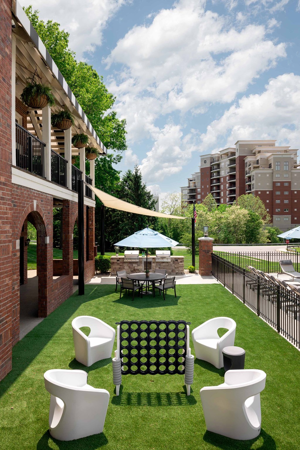The Overlook at St. Thomas Apartments Louisville poolside game yard
