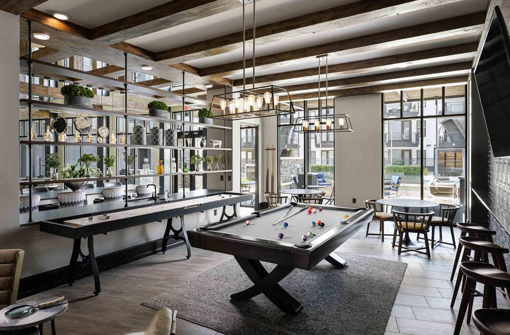 Upton Oxmoor Apartments Louisville entertainment lounge with pool table and shuffle board