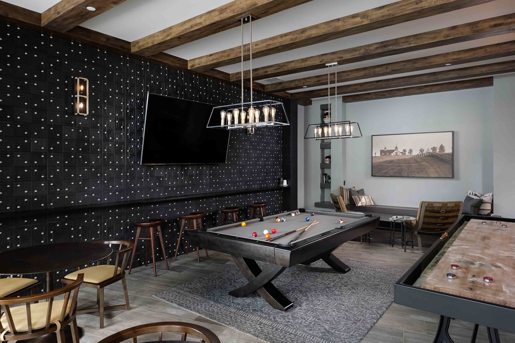 Upton Oxmoor Apartments Louisville entertainment lounge with pool table and shuffle board