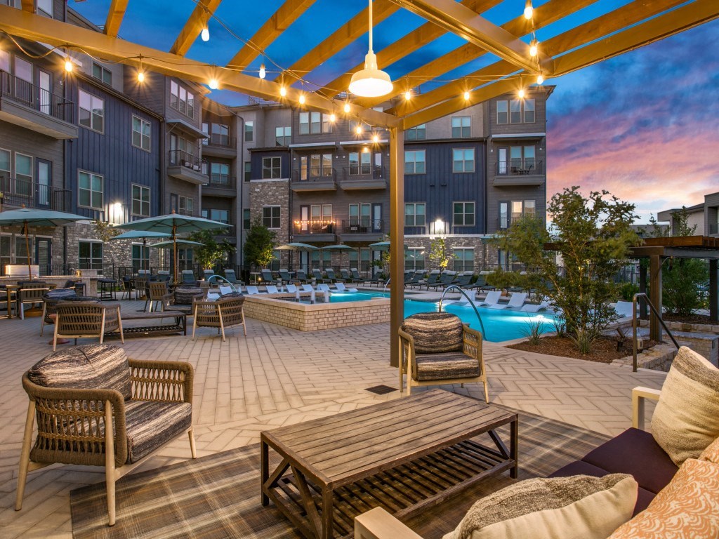 Westloop at the Diamond Interchange Irving TX outdoor lounge area at dusk