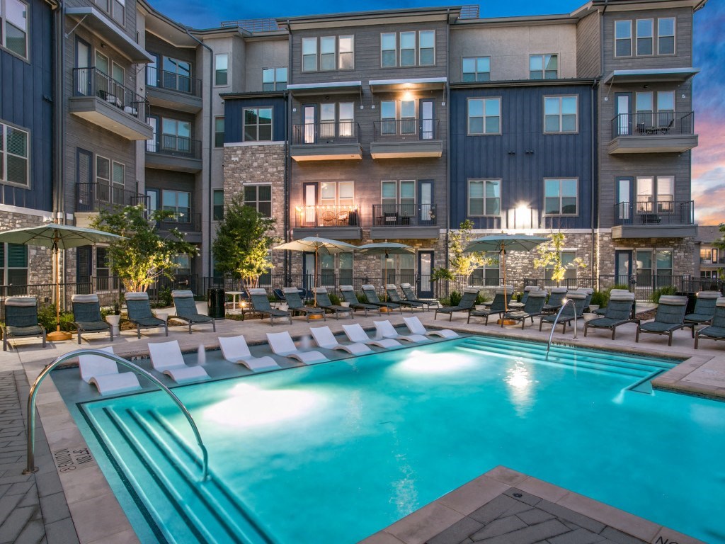 Westloop at the Diamond Interchange Irving TX  resort-style pool at dusk