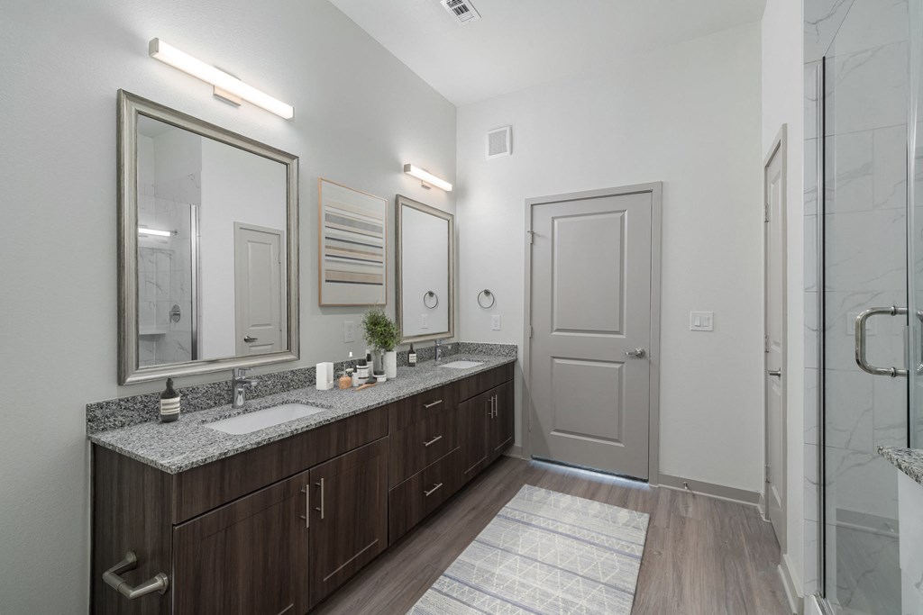 Westloop at the Diamond Interchange Irving TX  bathroom with double-vanity and walk-in shower