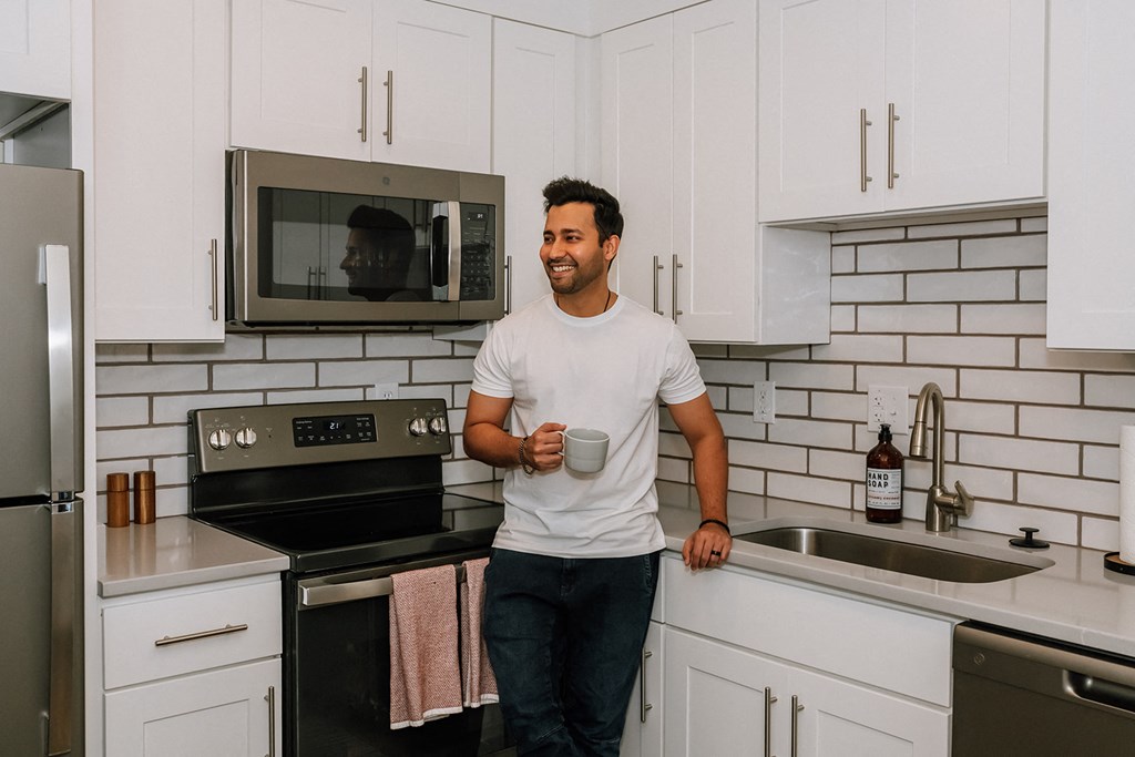 Hurstbourne Grand Apartments Louisville modern kitchen with custom cabinetry and backsplash