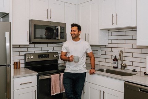 Hurstbourne Grand Apartments Louisville modern kitchen with custom cabinetry and backsplash