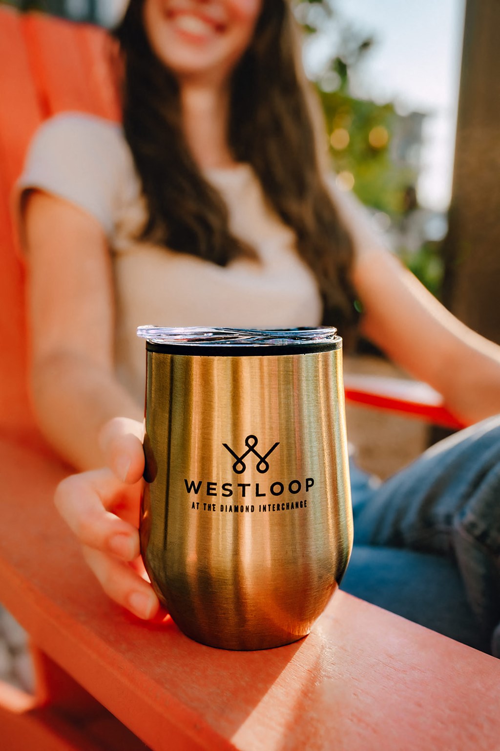 a woman holding a cup of coffee on a table