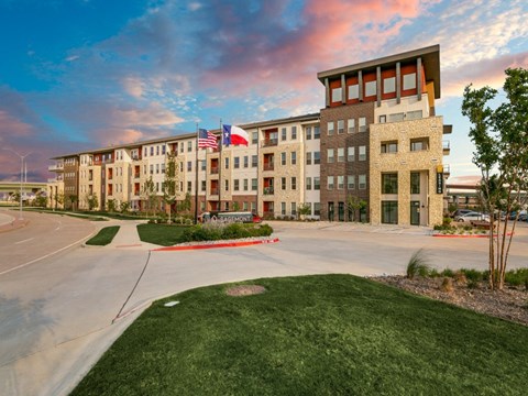 a large building with an flag in front of it