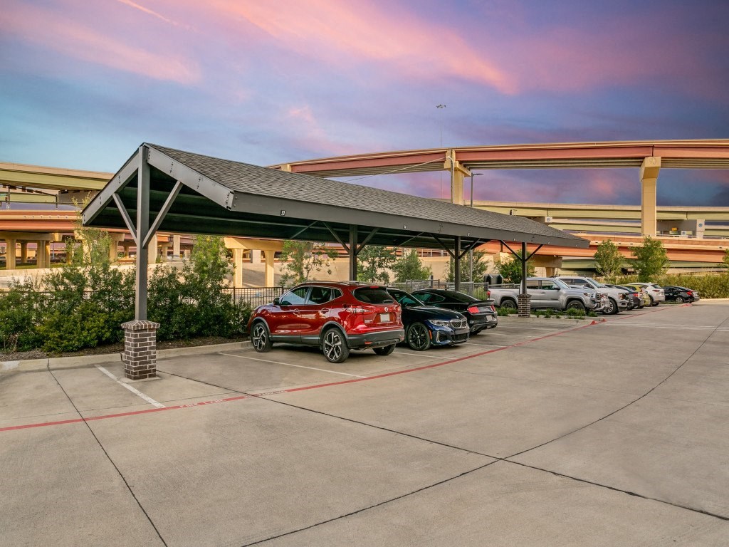 a parking lot with cars parked at a gas station